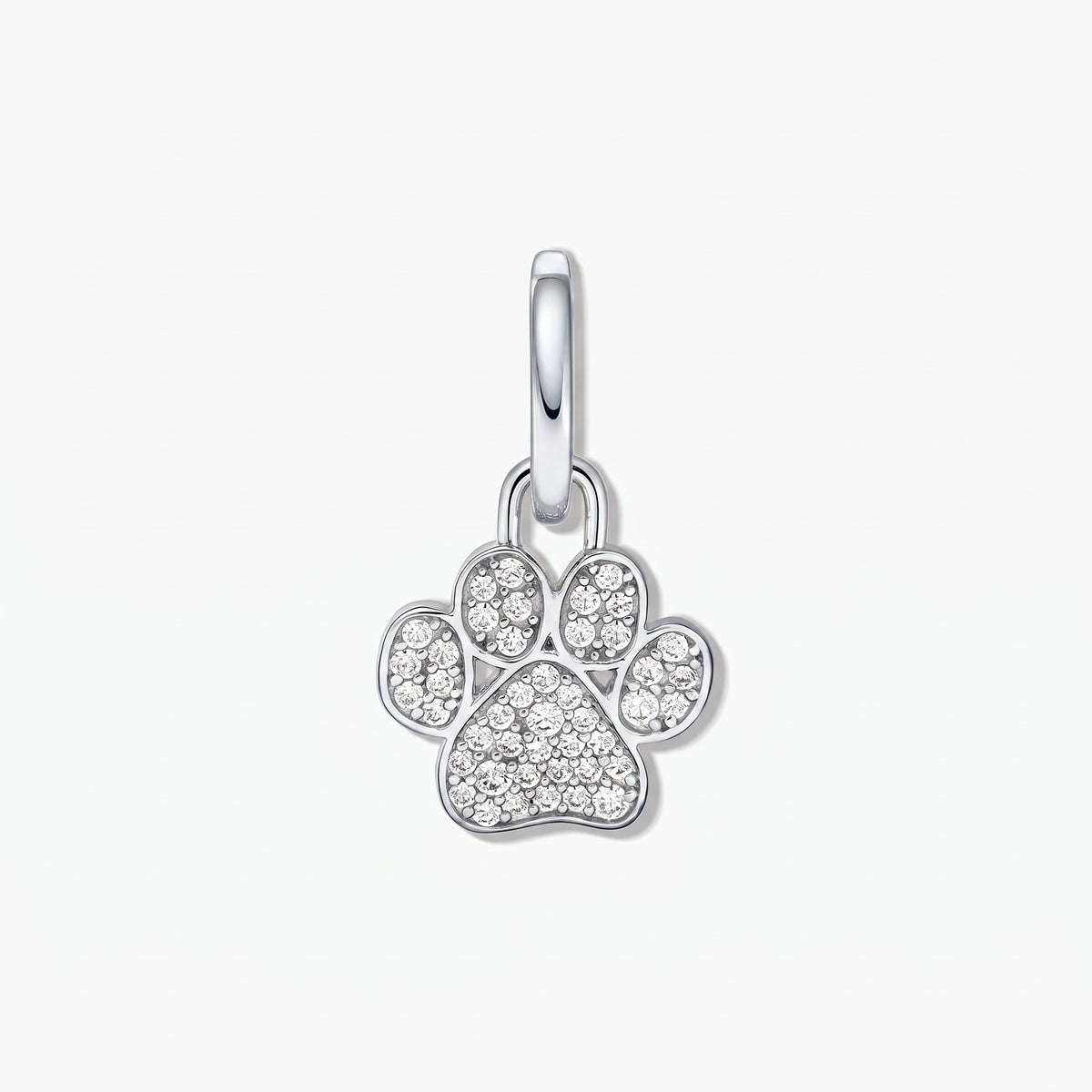 Sterling silver paw print pendant with white cubic zirconia pavé on a white background.