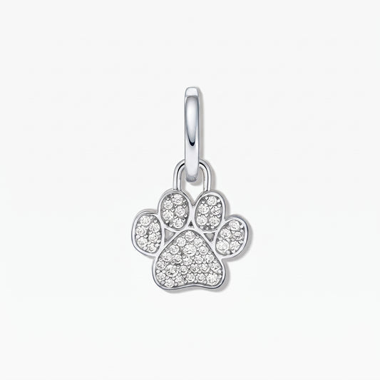 Sterling silver paw print pendant with white cubic zirconia pavé on a white background.