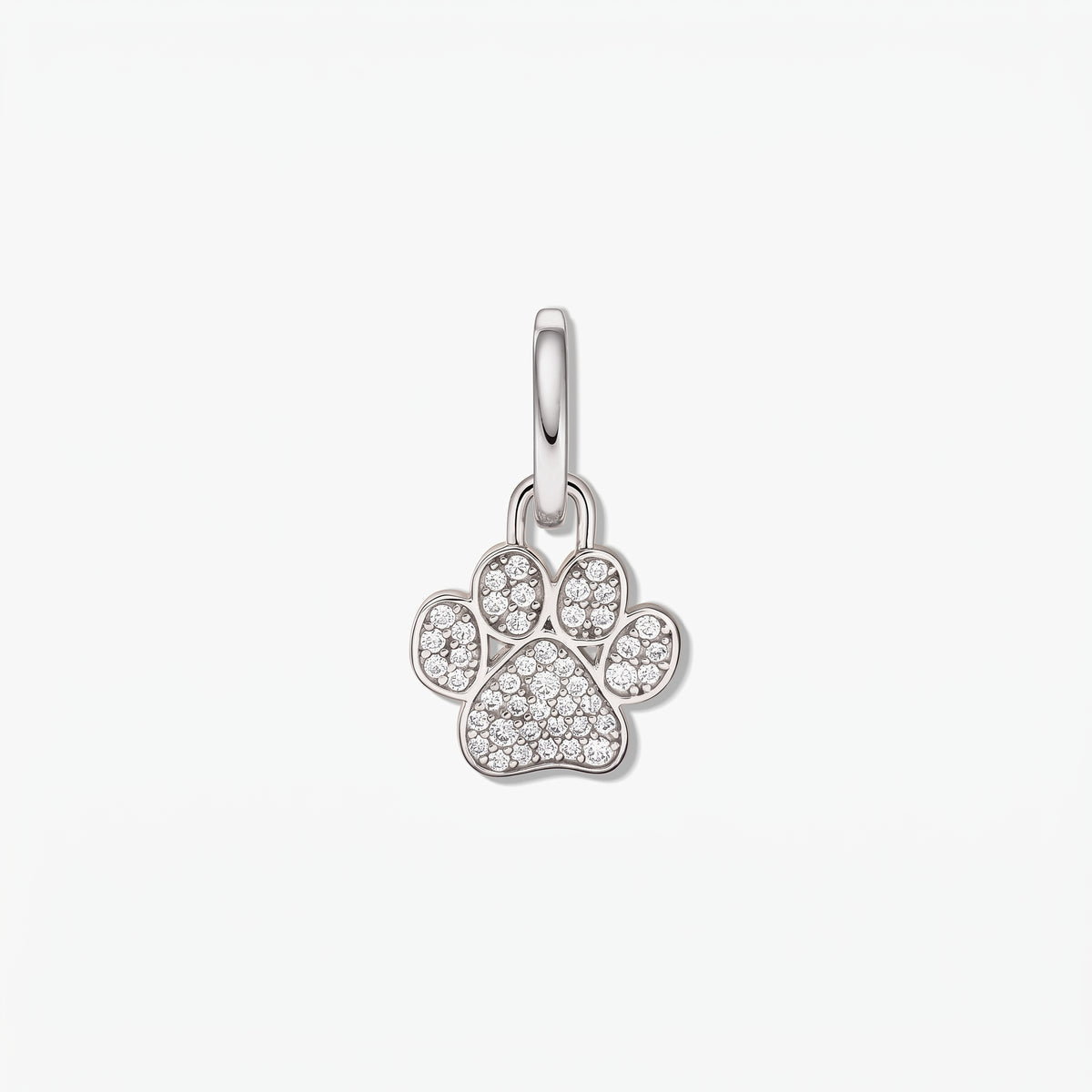 Sterling silver paw print pendant adorned with white cubic zirconia on a polished bail, isolated on a white background.