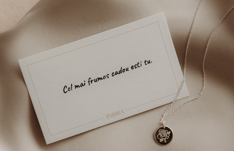 A written note, carried with the flower