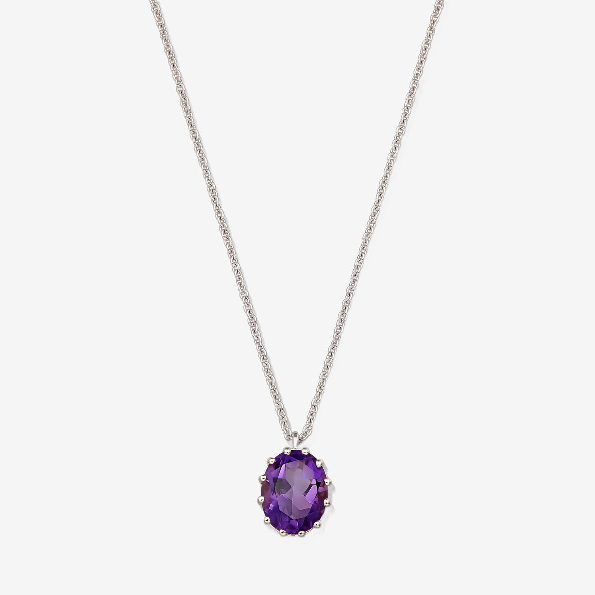 Sterling silver necklace featuring an oval faceted amethyst pendant on a white background.