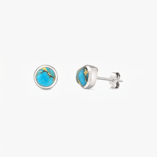 Pair of sterling silver stud earrings with round blue copper turquoise cabochons in bezel settings on a white background.