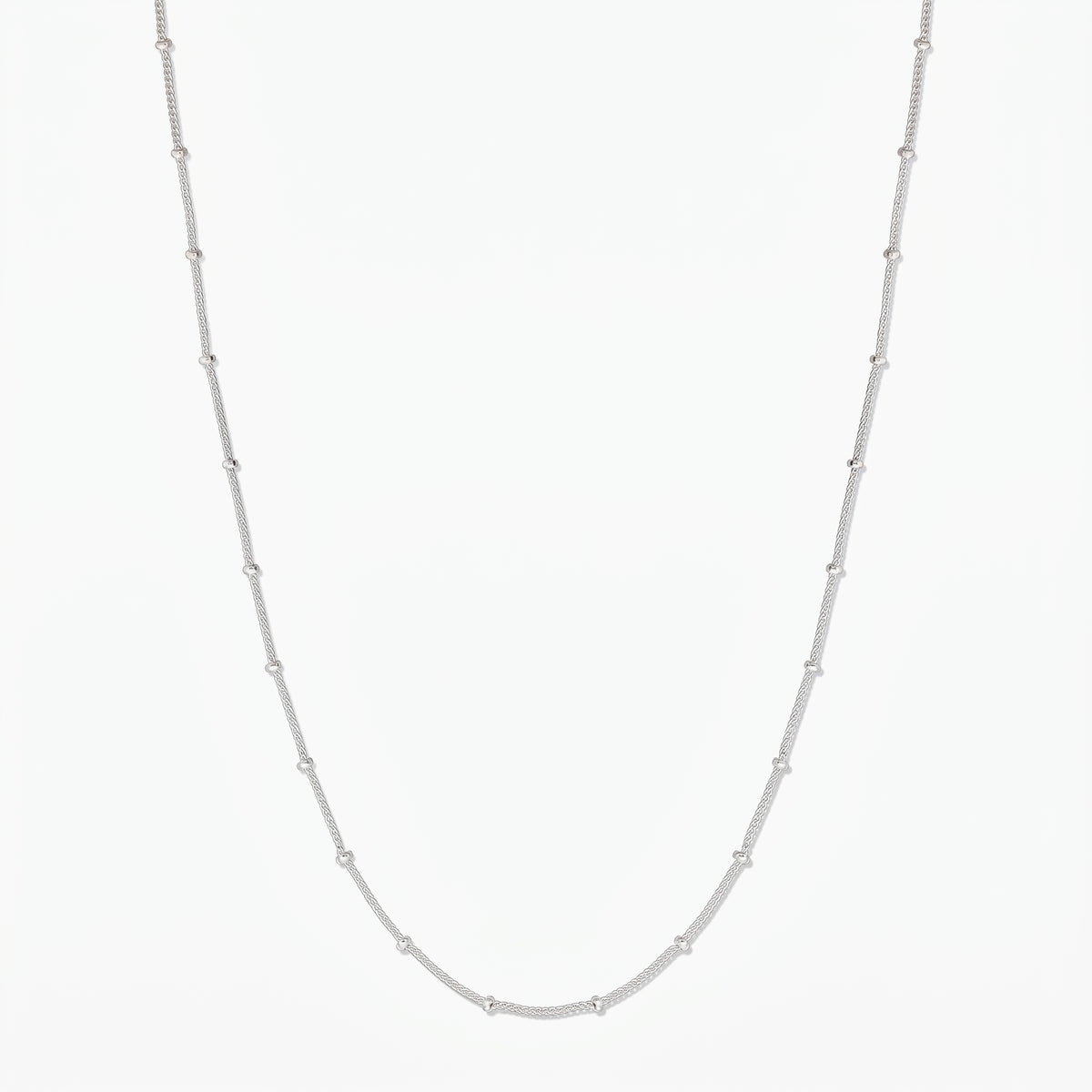 Full-length product image of a sterling silver beaded chain necklace on a white background.
