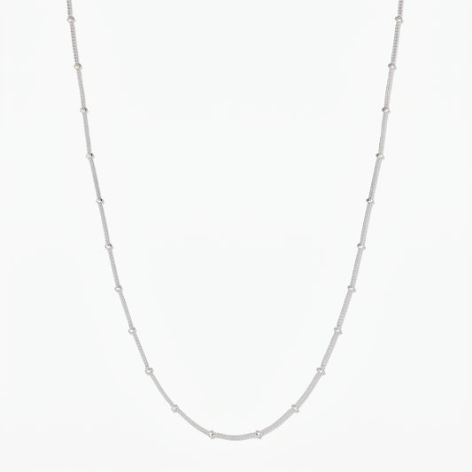 Full-length product image of a sterling silver beaded chain necklace on a white background.