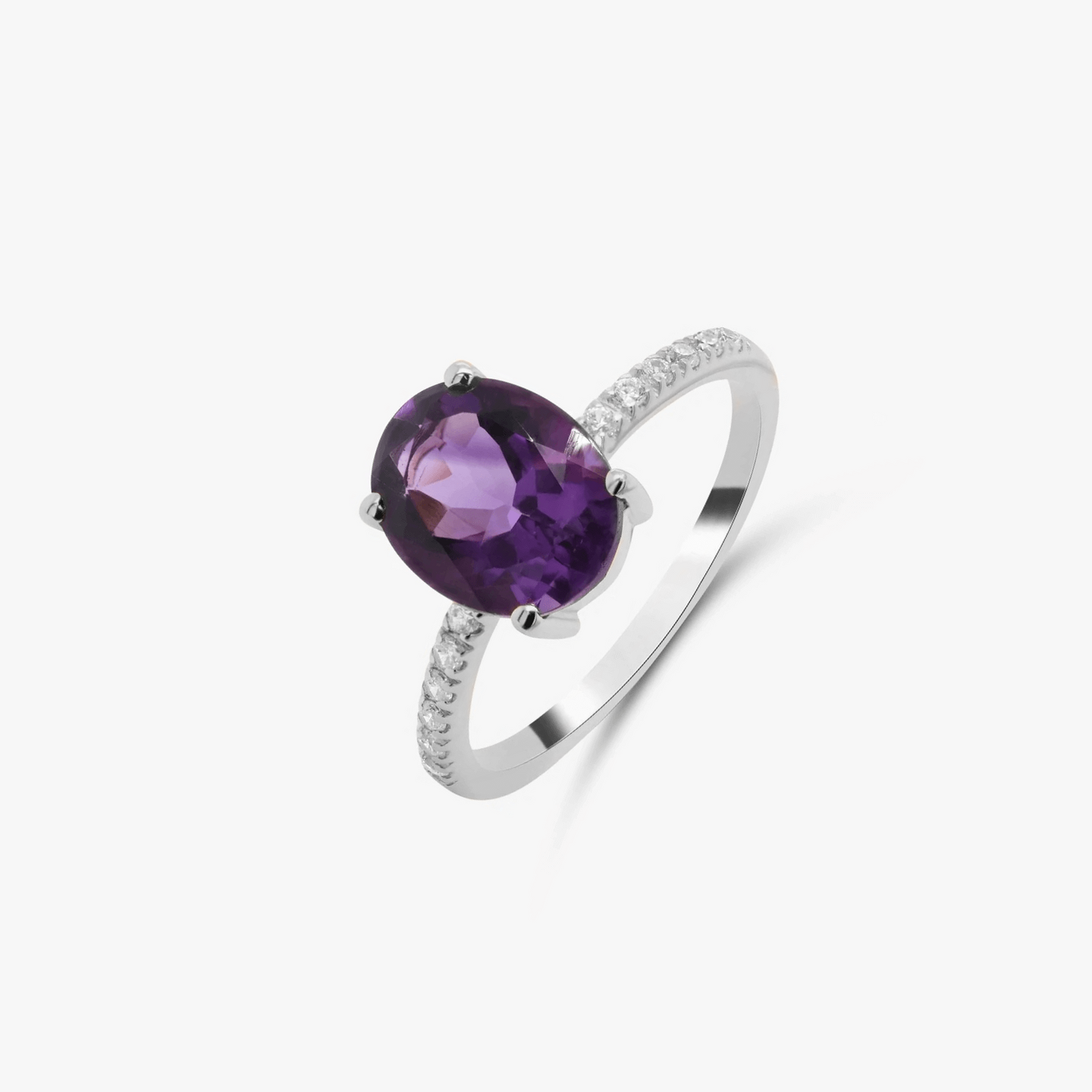 Silver ring with a purple amethyst and zirconia accents on a white background.
